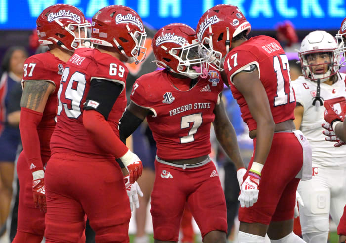 Dec 17, 2022; Inglewood, CA, USA; Fresno State Bulldogs running back Jordan Mims (7) celebrates with offensive lineman Jacob Spomer (69) and tight end Kamron Beachem (17) after scoring a touchdown against the Washington State Cougars in the second half of the LA Bowl at SoFi Stadium. Mandatory Credit: Jayne Kamin-Oncea-USA TODAY Sports
